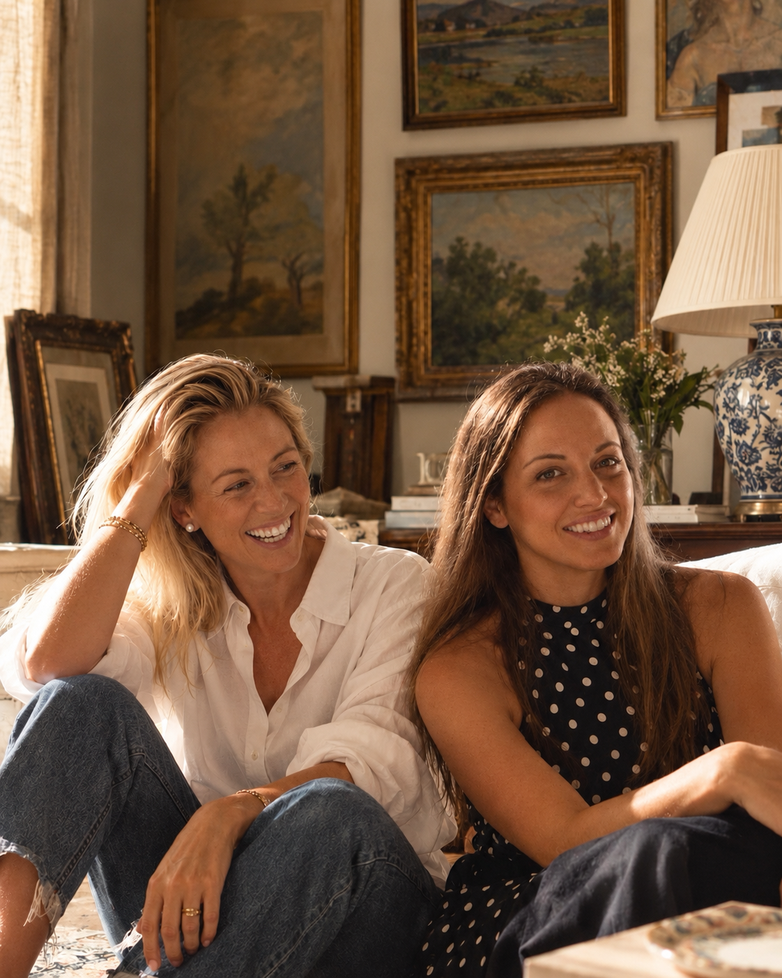 Domi and Nour at home, surrounded by paintings